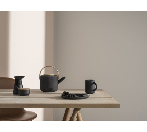 This black Stelton Theo stoneware teapot perfectly demonstrates Japandi design.