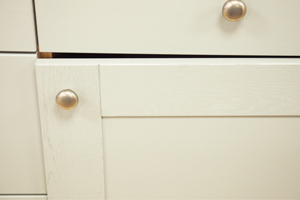 Kitchen cabinet hinges that need adjusting to realign the cupboard door.