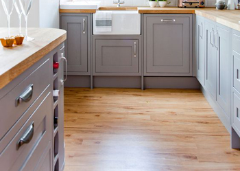 This laminate kitchen floor has the appearance of timber.