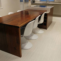 Dark wood and a simplistic design gives this integrated dining table a contemporary feel.