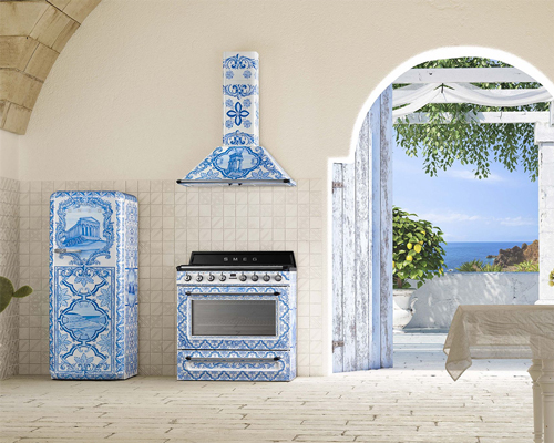 An open Mediterranean kitchen with an intricately designed Smeg fridge, oven and hood