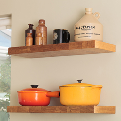 Open shelving with decorative kitchen items placed on the shelves