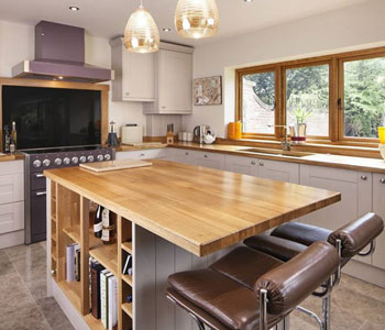 This kitchen features full stave prime oak worktops Elephants Breath Farrow And Ball.