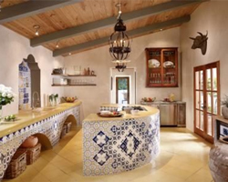 A Mexican kitchen with a large semi-circular tiled island