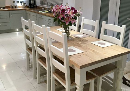 A pale coloured dining table to complement a light and airy kitchen. 