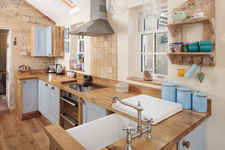 Farrow & Ball's Blue Ground is the colour of choice for this oak kitchen.