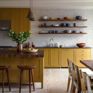 These yellow cabinets help to brighten the kitchen.