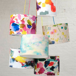 Five brightly coloured patterned lampshades