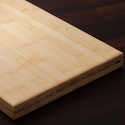 A solid bamboo chopping board