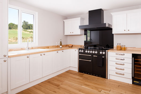 This white kitchen featuring solid wood worktops is a stylish, contemporary option that is perfect for a modern home