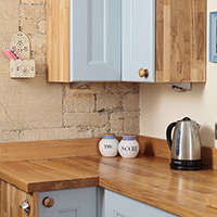 Corner wall units provide handy additional storage space in solid wood kitchens