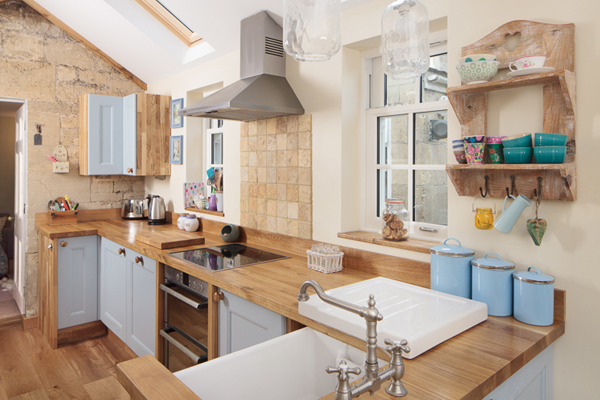 The exposed stonework in this kitchen combines beautifully with Traditional frontals in Farrow & Ball’s Lulworth Blue