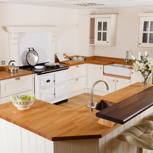 For an even more ornamental look in oak kitchens, frame your splashback with a surround.