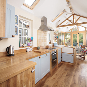 Full stave prime oak wooden worktop with Blue Ground solid oak kitchen cabinets.