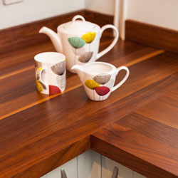 A full-stave worktop with a colourful teapot and mug.