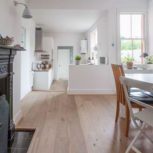 Removing the wall between the kitchen and dining area in this home has really opened up the space, giving the galley kitchen design a much larger look