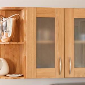 Shiny objects and glass cabinet fronts create depth in solid wood kitchens.