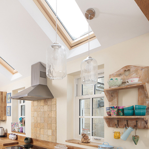 Glass light fittings in solid wood kitchens.