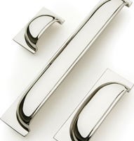 Queslett cup handles for drawers with a polished nickel finish.