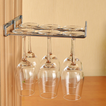 Invest in a hanging glasses rack to free up much needed cupboard space in oak kitchens