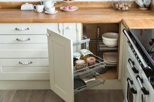 Kitchen wirework provides an elegant storage solution for solid oak kitchens.