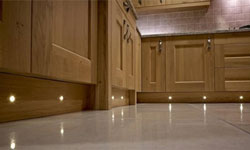 A traditional oak kitchen with plinth lighting