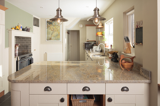 Warm Lime White by Farrow & Ball brings warmth to these Venetian gold granite tops.