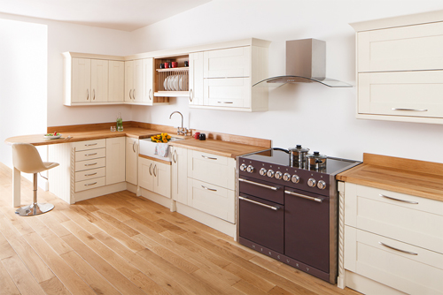 A kitchen with New White Shaker frontals and a full stave prime oak worktop.