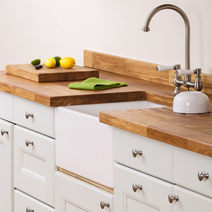 Oak worktops are traditional and charming, and perfect for vintage solid wood kitchens.