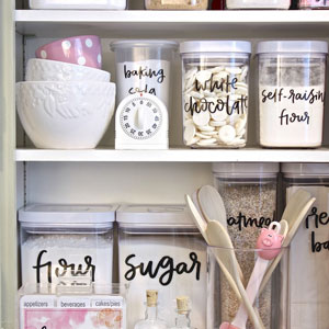 The owner of this pantry cabinet has decanted everything into coordinating containers for an organised, cohesive look.