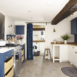 Evoke seaside-chic in your wooden kitchen with contrasting white and blue oak cabinets.