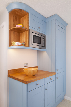 Sophisticated Shaker cornices and pelmet look splendid in this Lulworth Blue kitchen