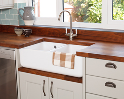 Double-bowl Belfast sink with a sink cabinet and Deluxe black American walnut worktops.
