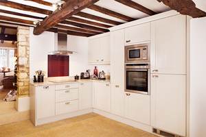 Solid wood kitchen with frontals painted in Farrow & Ball’s All White.