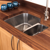 This undermounted sink fits snugly above our solid wood sink housing cabinet.