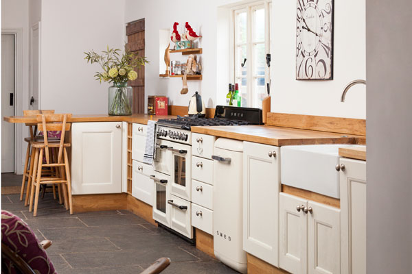 The white kitchen doors in this home are the perfect way to create a country style