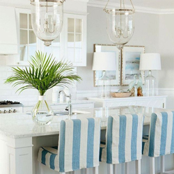 All-white kitchens look incredibly eye-catching with the use of a bright and bold nautical print.