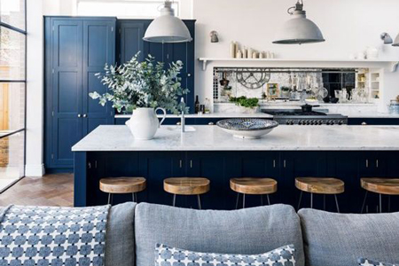 This light and airy open plan kitchen has been designed with a blue and white colour scheme.