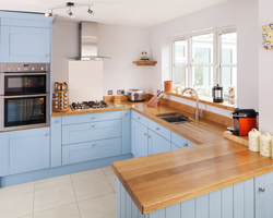 This kitchen features the Farrow & Ball colour Lulworth Blue on the cabinet frontals.