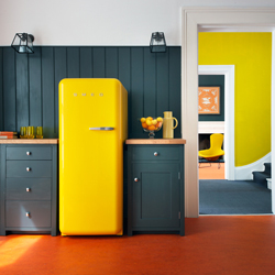 This yellow Smeg fridge really pops out against the dark colour shaker doors.
