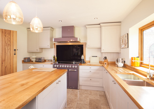 Fit your own wooden kitchen cupboards to save money on the cost of a kitchen fitter.