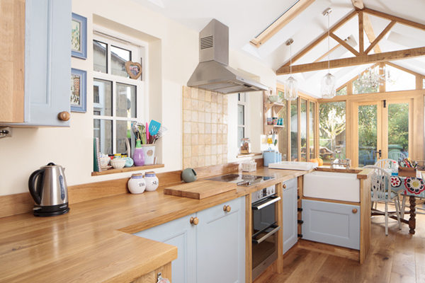 A pop of colour is added to this kitchen with painted frontals, and this is picked up in the table cloth, along with other accents in the room – perfect for creating a shabby chic look