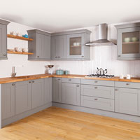 Our shaker kitchen cabinets painted in a light grey and topped with our solid wood worktop