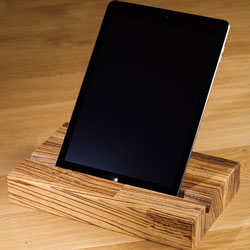 A solid wood tablet holder with an iPad on