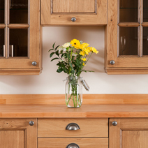 Solid oak kitchen cabinets designed to create a dresser.