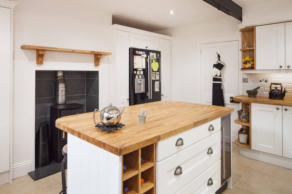 The cupboards around the fridge were created for this farmhouse kitchen using our cabinet doors, so they match the rest of the room perfectly